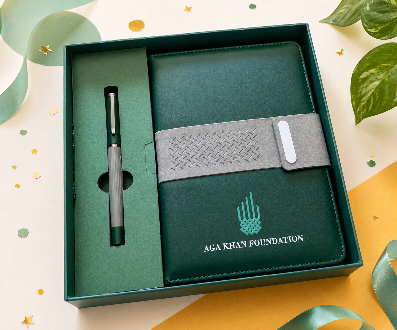 Green Aga Khan Foundation branded notebook and pen gift set